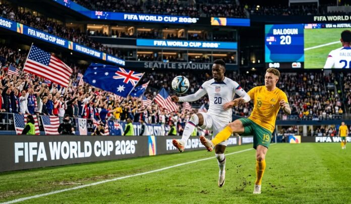USA vs Australia World Cup 2026 Match Highlights Folarin Balogun of the USMNT battles for possession against an Australian defender during the 2026 World Cup match at Seattle Stadium.