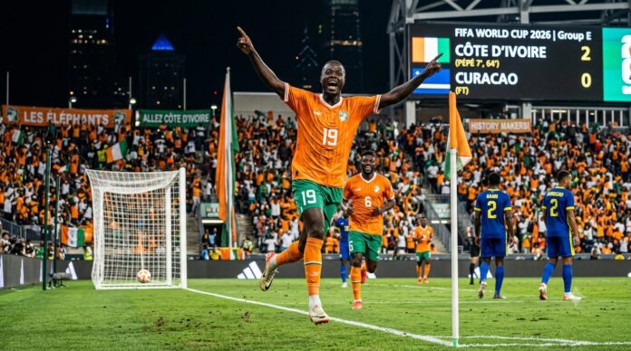 Ivory Coast vs Curacao 2026 World Cup Highlights Nicolas Pepe Celebration Nicolas Pépé of Ivory Coast celebrating his historic brace against Curacao at the FIFA World Cup 2026 with a stadium scoreboard in the background.
