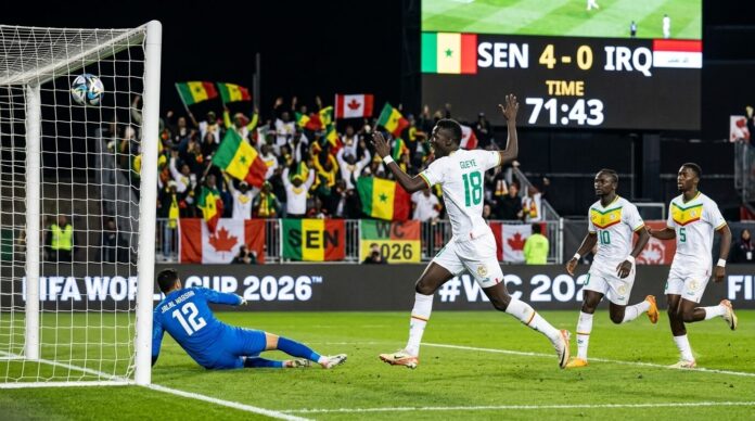 Pape Gueye Goal Celebration Senegal vs Iraq World Cup Match 2026 Pape Gueye celebrating a goal with his teammates during the Senegal vs Iraq World Cup match 2026.