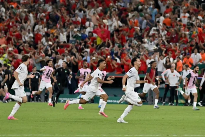 FIFA World Cup 2026 Round of 32 Penalty Shootout Upset Celebration Players celebrate wildly on the pitch while the opposing team slumps in devastation after a dramatic penalty shootout victory in the 2026 World Cup Round of 32 knockout stage.