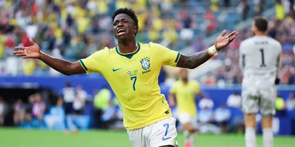images (16) Vinícius Júnior of Brazil runs with his arms outstretched celebrating his goal against Scotland during the World Cup 2026 group stage match.