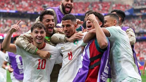 images (42) Azzedine Ounahi and Morocco national team football players passionately celebrating a goal during their FIFA World Cup 2026 knockout match against Canada.