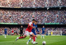 Domestic Leagues Return: 3 Huge Storylines After a Wild European Midweek Domestic leagues return as Premier League players battle intensely for possession during a packed stadium weekend match.