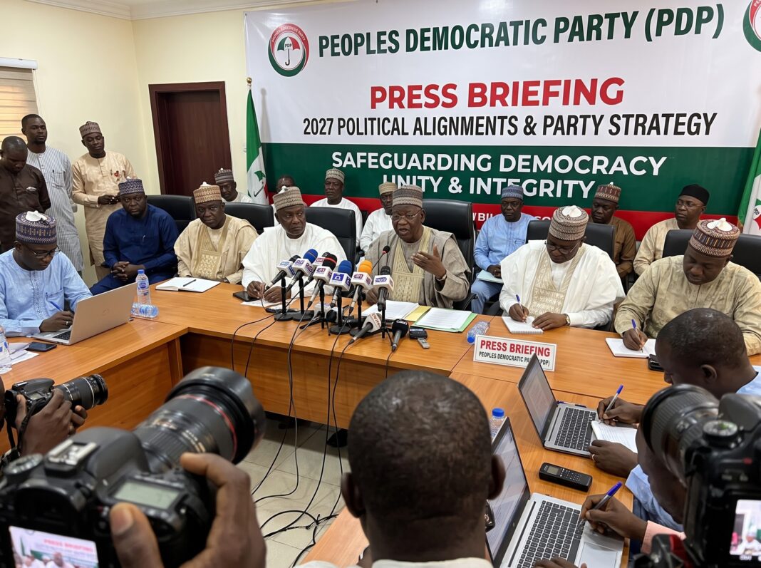 1792611838288 2027 election political alignments discussion at a Peoples Democratic Party press briefing in Nigeria.