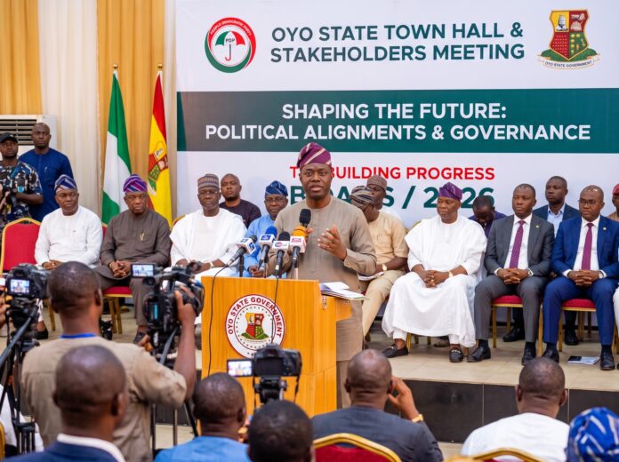 Seyi Makinde 2027 presidency speculations rise as the Oyo State Governor addresses a stakeholders meeting from a podium.