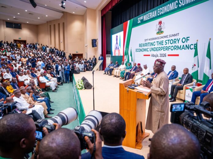 President Bola Tinubu addressing the 32nd Nigerian Economic Summit in Abuja to defend the Tinubu economic reforms 2027 agenda.