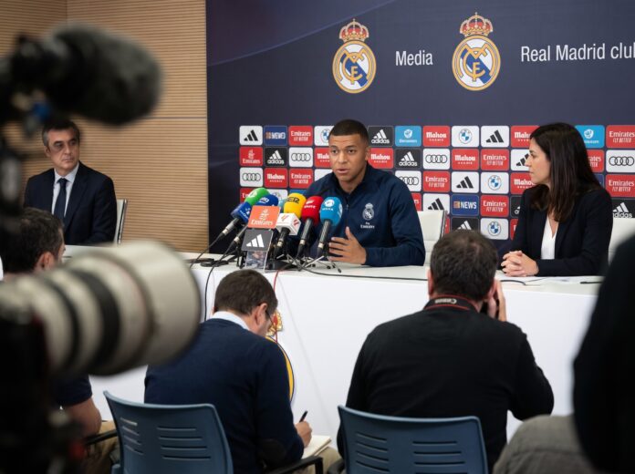 Real Madrid forward Kylian Mbappe speaks to journalists at a press conference as he addresses the Kylian Mbappe China controversy.