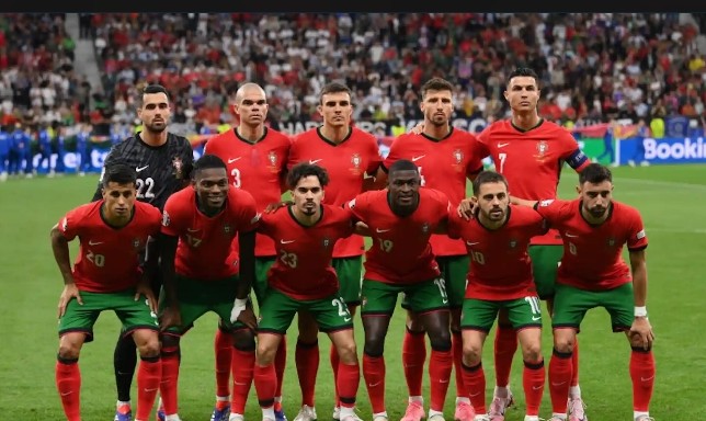 Screenshot_2026-10-08-12-46-01-57_680d03679600f7af0b4c700c6b270fe7~2 Portugal national football team players celebrating on the pitch during their recent Portugal FIFA ranking climb.