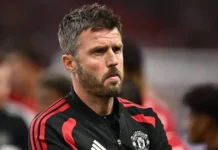 Michael Carrick United crisis: 6 Brutal October Fixtures Threaten Manager A serious-looking Michael Carrick in a Manchester United jacket amidst the mounting Michael Carrick United crisis